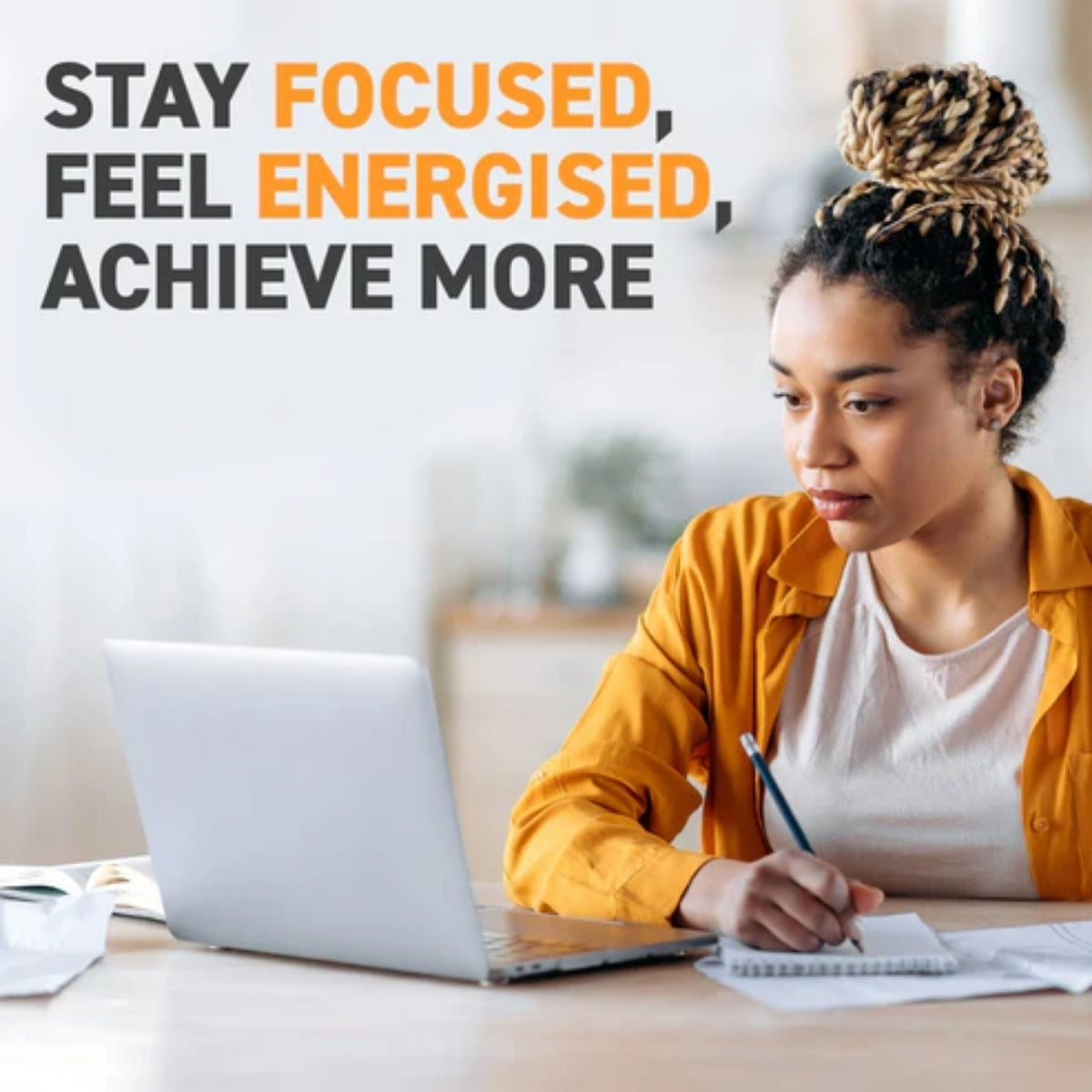 Woman working on a laptop with motivational text 'Stay Focused, Feel Energised, Achieve More' above her.